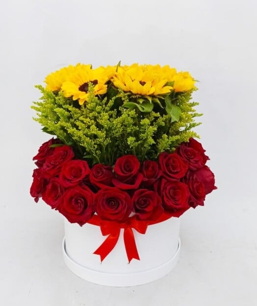 Floral arrangement with roses and sunflowers