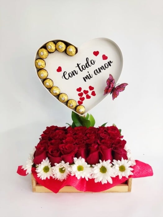 Arrangement in a wooden box with roses and chocolates