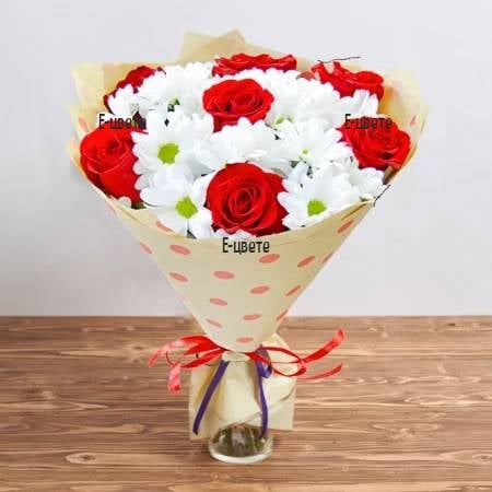 A bouquet of roses and chrysanthemums