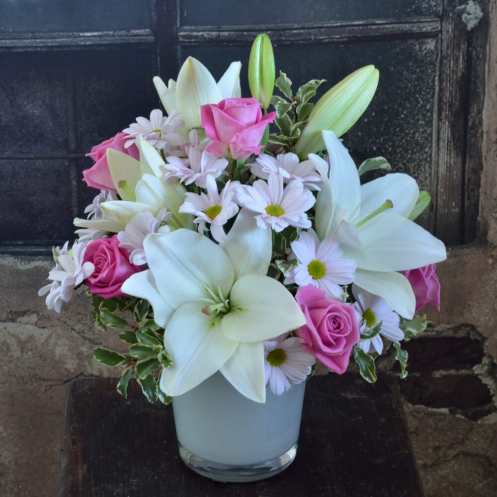 Light pink bouquet of white lilies and pink roses