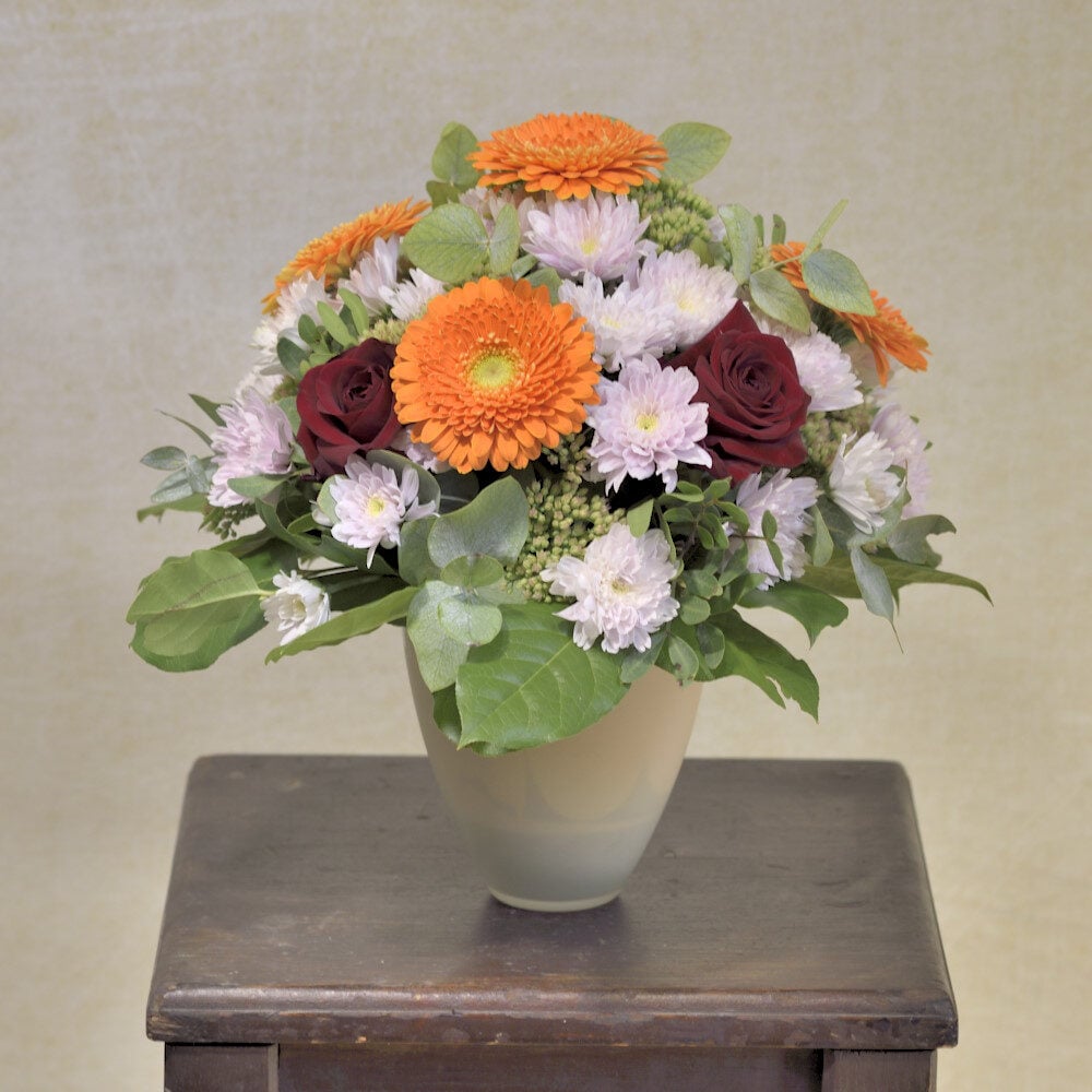 Bouquet with orange gerberas and red roses